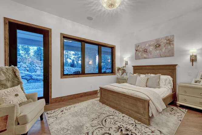 Bedroom with wood bed and area rug