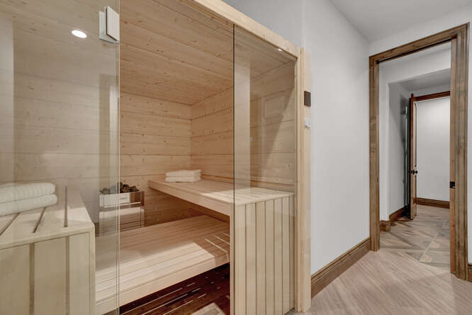 Built-in home sauna with glass doors