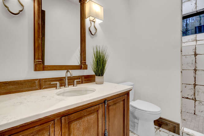 Bathroom with medium wood tone cabinets