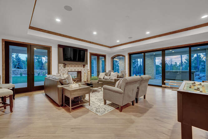 Lower level family room with dual sided fireplace