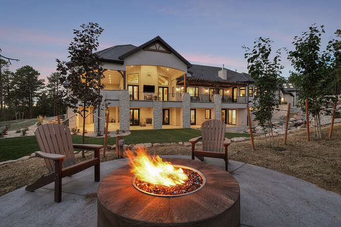 Rear Elevation of house with fire pit patio