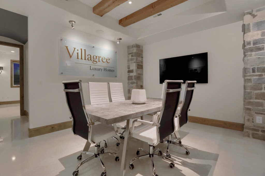 team experience design room with a large table and office chairs surrounding it