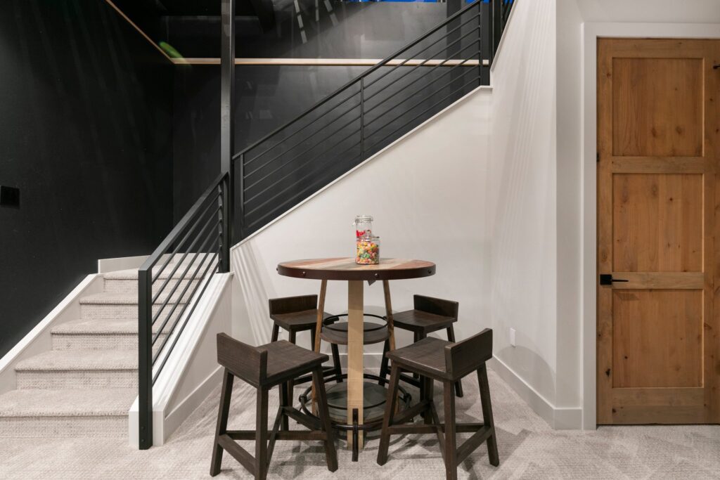 Lower level living space with stairs and a safe room