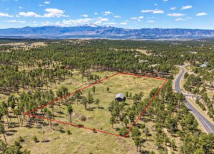 Sweeping front range views including Pikes Peak. Sprawling 5 acre gated, private homesite for estate lifestyle living.